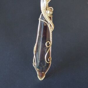 Elegant Gold and Black Wire-Wrapped Pendant